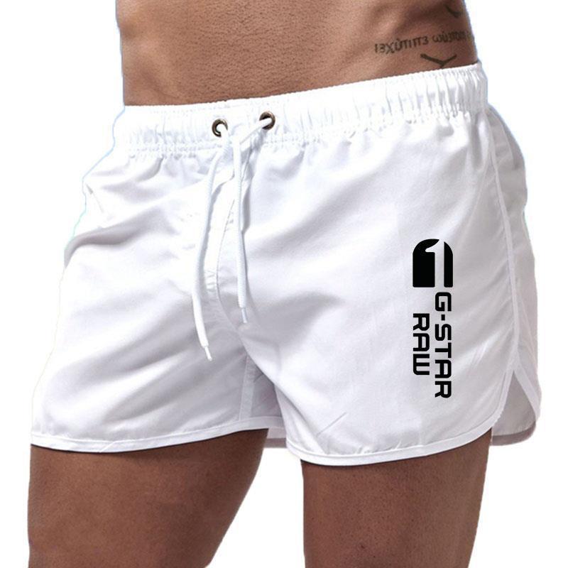 Men's fashionable beach shorts polyester multi - color sports men's three part shorts - FashionTech