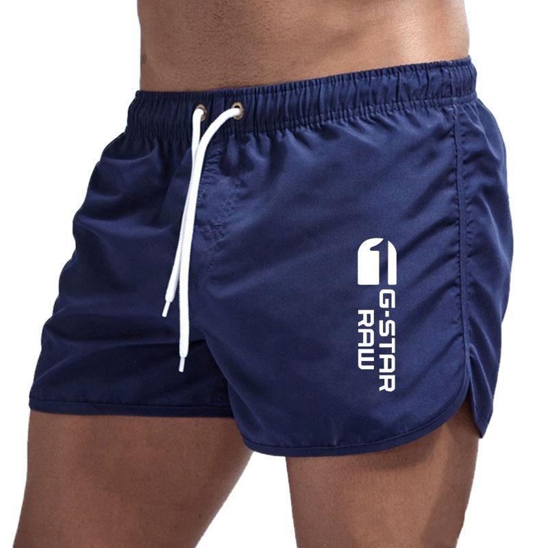 Men's fashionable beach shorts polyester multi - color sports men's three part shorts - FashionTech