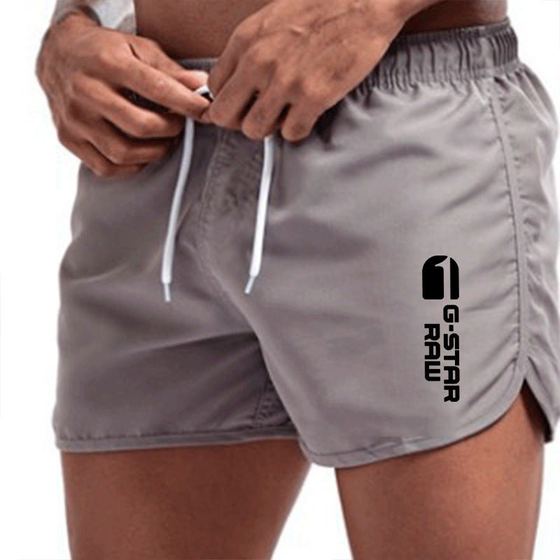 Men's fashionable beach shorts polyester multi - color sports men's three part shorts - FashionTech