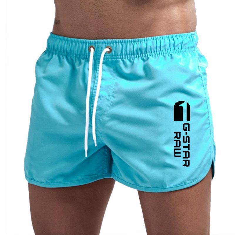 Men's fashionable beach shorts polyester multi - color sports men's three part shorts - FashionTech