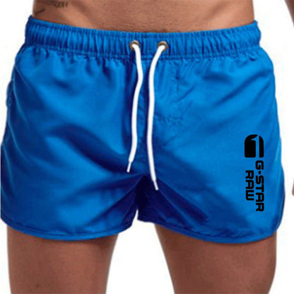 Men's fashionable beach shorts polyester multi - color sports men's three part shorts - FashionTech